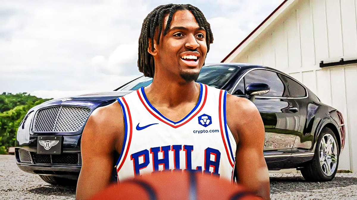 Tyrese Maxey in front of a car from his collection.