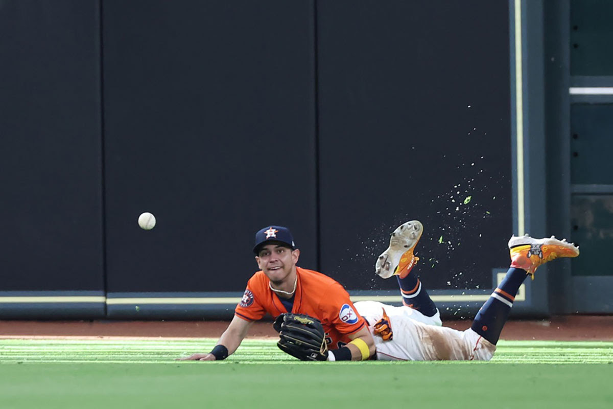Houston Astros outfielder Mauricio Dubon (14) dives but cannot catch this ball hit for a single by Detroit Tigers catcher Jake Rogers (34) during the ninth inning of game two of the Wildcard round for the 2024 MLB Playoffs at Minute Maid Park.