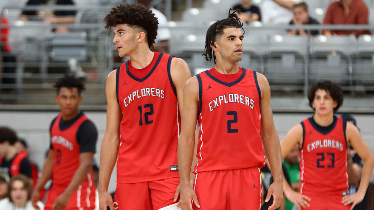 Columbus player Cameron Boozer (12) and brother Cayden Boozer (2) during the Section 7 high school boys tournament at State Farm Stadium.