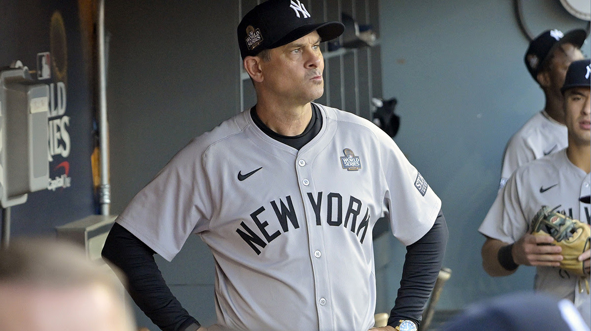 New York Yankees manager Aaron Boone (17) ooks on from the dugout before game one against the Los Angeles Dodgers in the 2024 MLB World Series at Dodger Stadium.