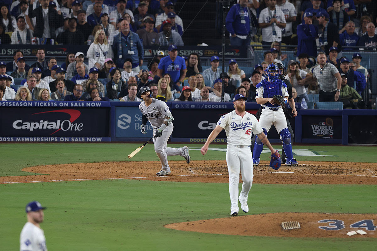 New York Yankees second baseman Gleyber Torres (25) hits a double in the ninth inning against the Los Angeles Dodgers during game one of the 2024 MLB World Series at Dodger Stadium.
