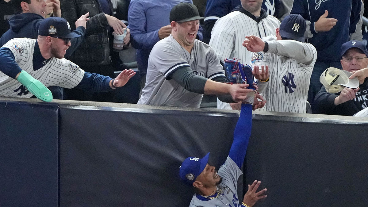 Los Angeles Dodgers outfielder Mookie Betts (50) makes a catch in foul terriotory against the New York Yankees in the first inning during game four of the 2024 MLB World Series at Yankee Stadium.