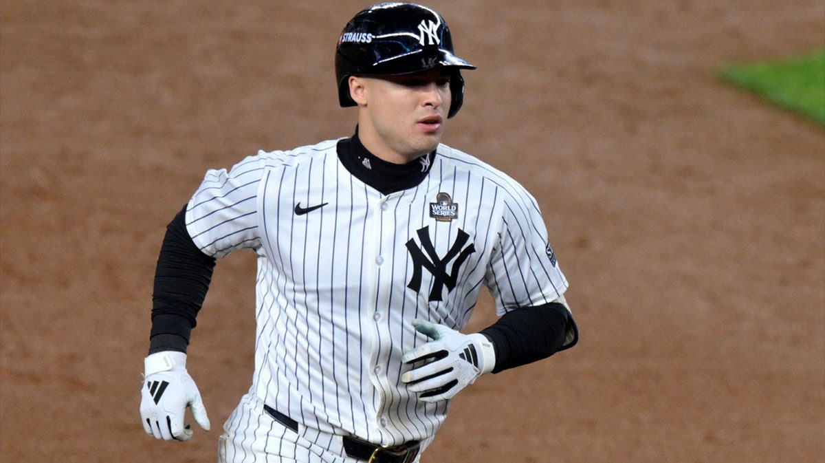 New York Yankees shortstop Anthony Volpe (11) rounds the bases after hitting a grand slam during the third inning against the Los Angeles Dodgers in game four of the 2024 MLB World Series at Yankee Stadium.