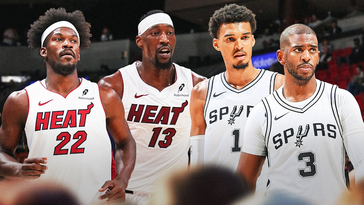 Miami Heat stars Jimmy Butler and Bam Adebayo looking at Victor Wembanyama and Chris Paul in front of Kaseya Center.
