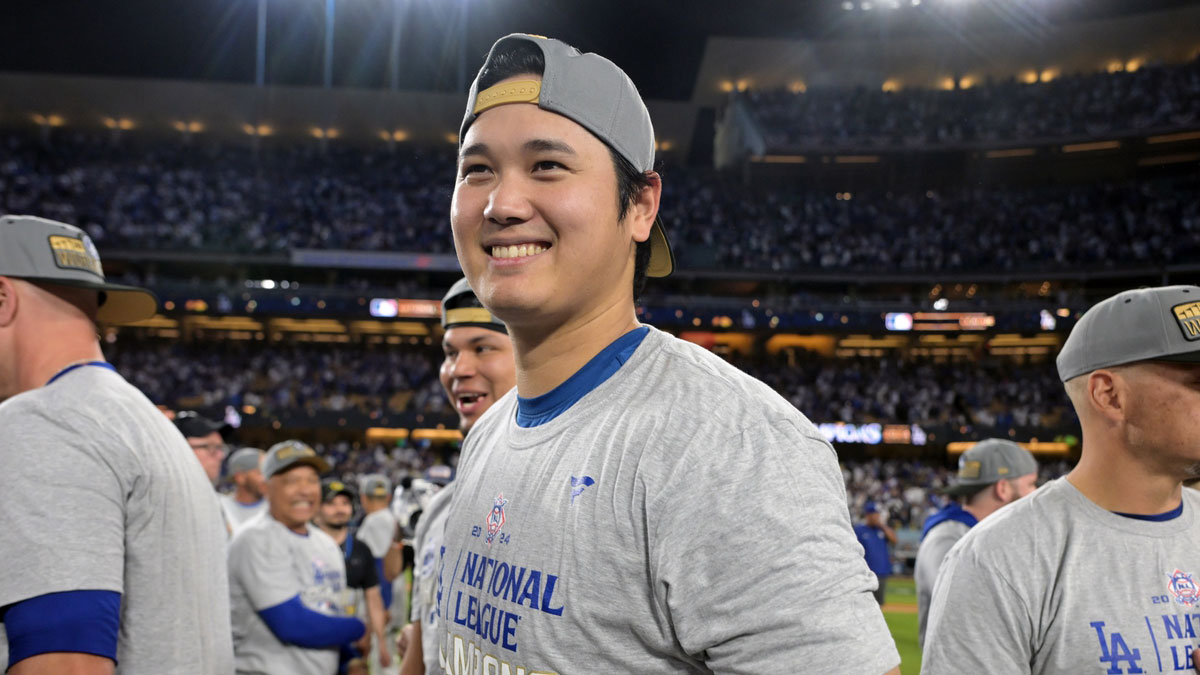 Los Angeles Dodgers designated hitter Shohei Ohtani (17) celebrates on the field after defeating the New York Mets in game six of the NLCS for the 2024 MLB playoffs to advance to the World Series at Dodger Stadium.