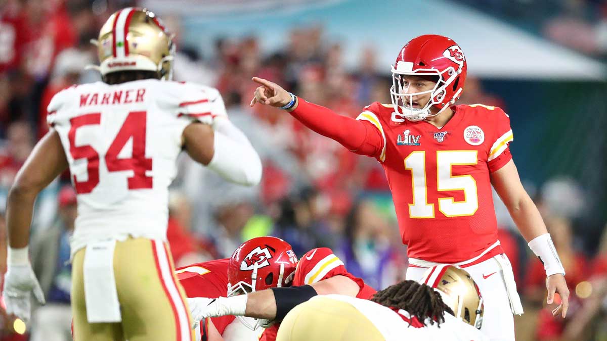 Kansas City Chiefs quarterback Patrick Mahomes (15) points to San Francisco 49ers middle linebacker Fred Warner (54) in the first quarter in Super Bowl LIV at Hard Rock Stadium