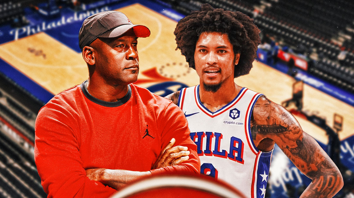 76ers forward Kelly Oubre next to Hornets former owner Michael Jordan with fire eyes