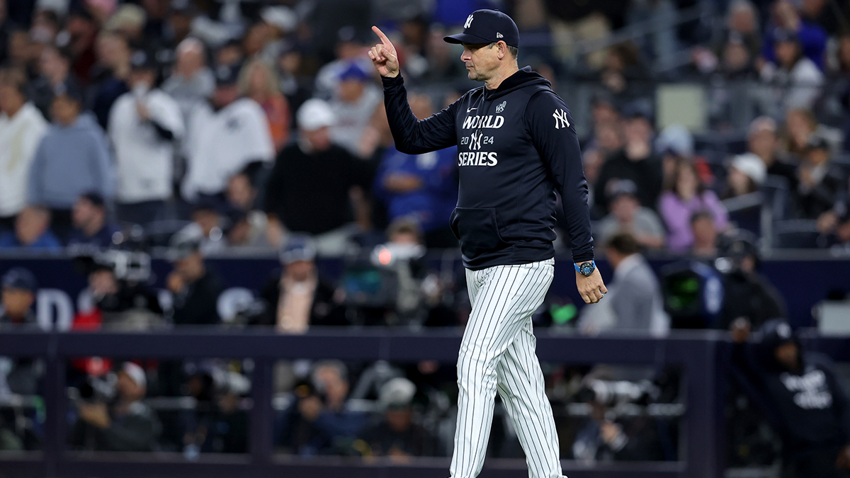 New York Yankees manager Aaron Boone (17) makes a pitching change during the fifth inning against the Los Angeles Dodgers in game four of the 2024 MLB World Series at Yankee Stadium.