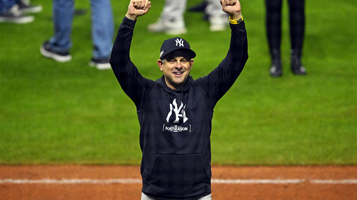 New York Yankees manager Aaron Boone (17) celebrates after beating the Cleveland Guardians during game five of the ALCS for the 2024 MLB playoffs at Progressive Field.