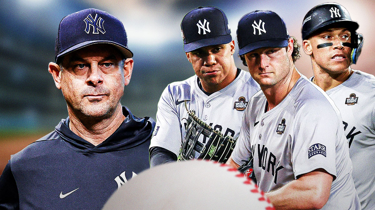 Photo: Aaron Boone looking serious in Yankees gear, Aaron Judge, Juan Soto, Gerrit Cole all looking stressed behind him