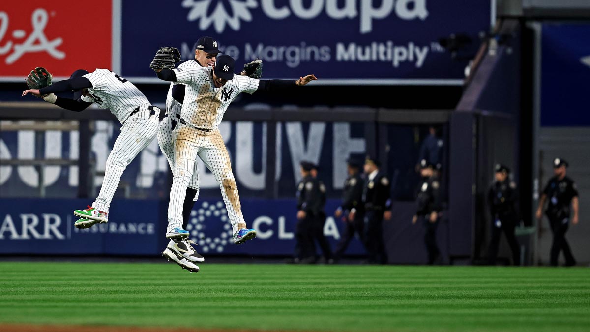 New York Yankees outfielder Juan Soto (22), outfielder Aaron Judge (99) and outfielder Alex Verdugo (24) celebrate after defeating the Cleveland Guardians in Game 2 of the ALCS for the MLB Playoffs on 2024 at Yankee Stadium.