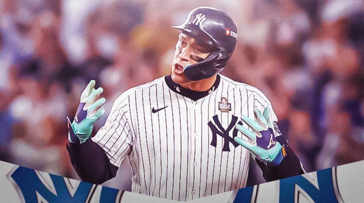 Aaron Judge in Yankees uniform with hands on his head, stoic expression