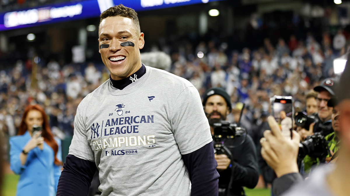 New York Yankees outfielder Aaron Judge (99) celebrates after beating the Cleveland Guardians during game five of the ALCS for the 2024 MLB playoffs at Progressive Field.