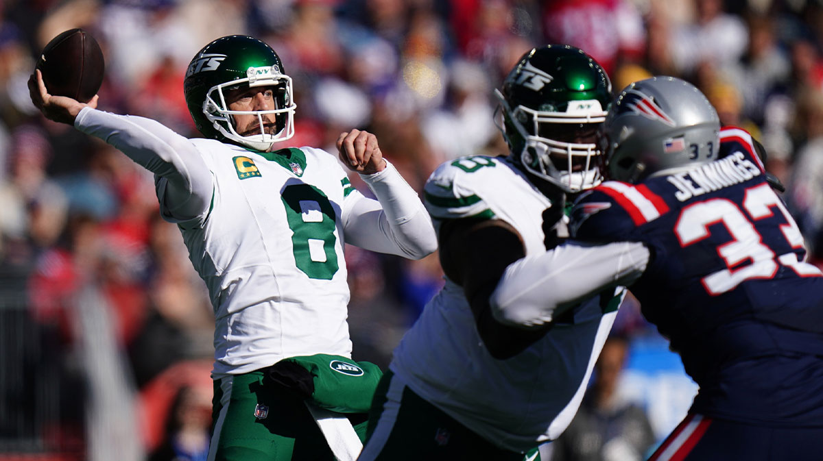 New York Jets quarterback Aaron Rodgers (8) throws a pass against the New England Patriots in the second quarter at Gillette Stadium.