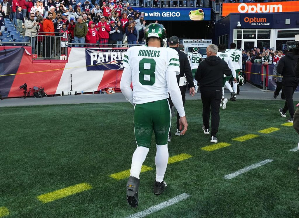 New York Jets quarterback Aaron Rodgers (8) exits the field after being defeated by the New England Patriots in the second half at Gillette Stadium