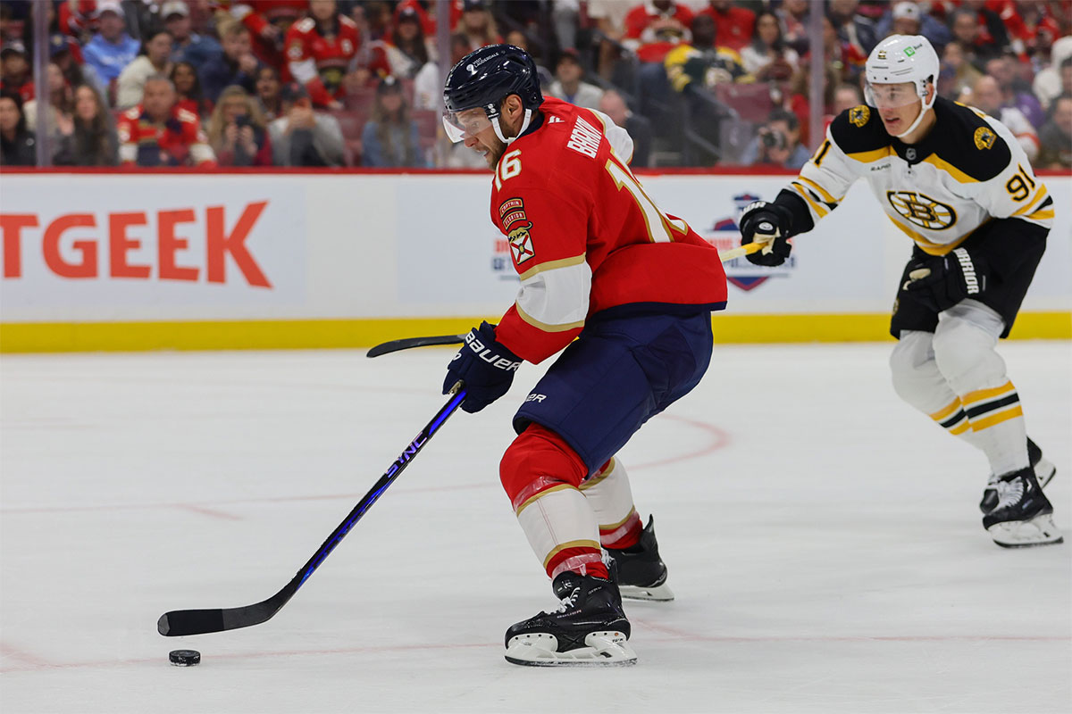 Florida Panthers center Aleksander Barkov (16) moves the puck past Boston Bruins defenseman Nikita Zadorov (91) during the second period at Amerant Bank Arena. 
