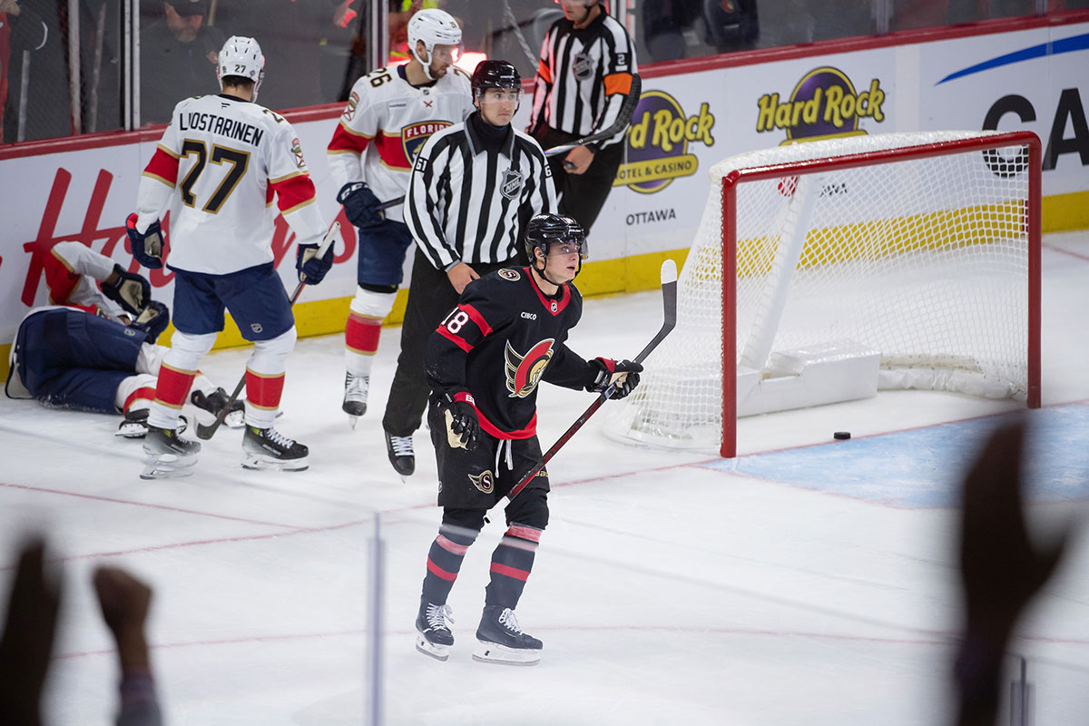Ottawa Senators center Tim Stutzle (18) scores an empty net goal after battling with Florida Panthers center Aleksander Barkov (16) who sustained an injury on the play in the third period at the Canadian Tire Centre.