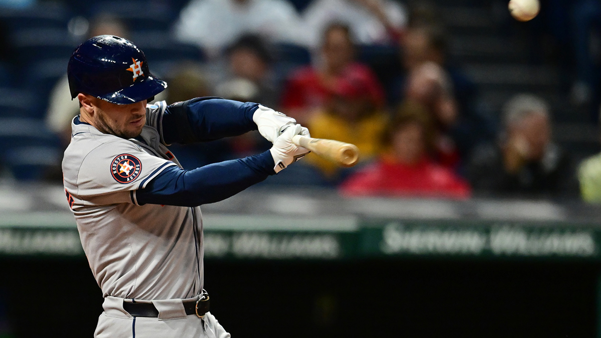 Houston Astros third baseman Alex Bregman (2) hits a sacrifice fly during the first inning against the Cleveland Guardians at Progressive Field. 