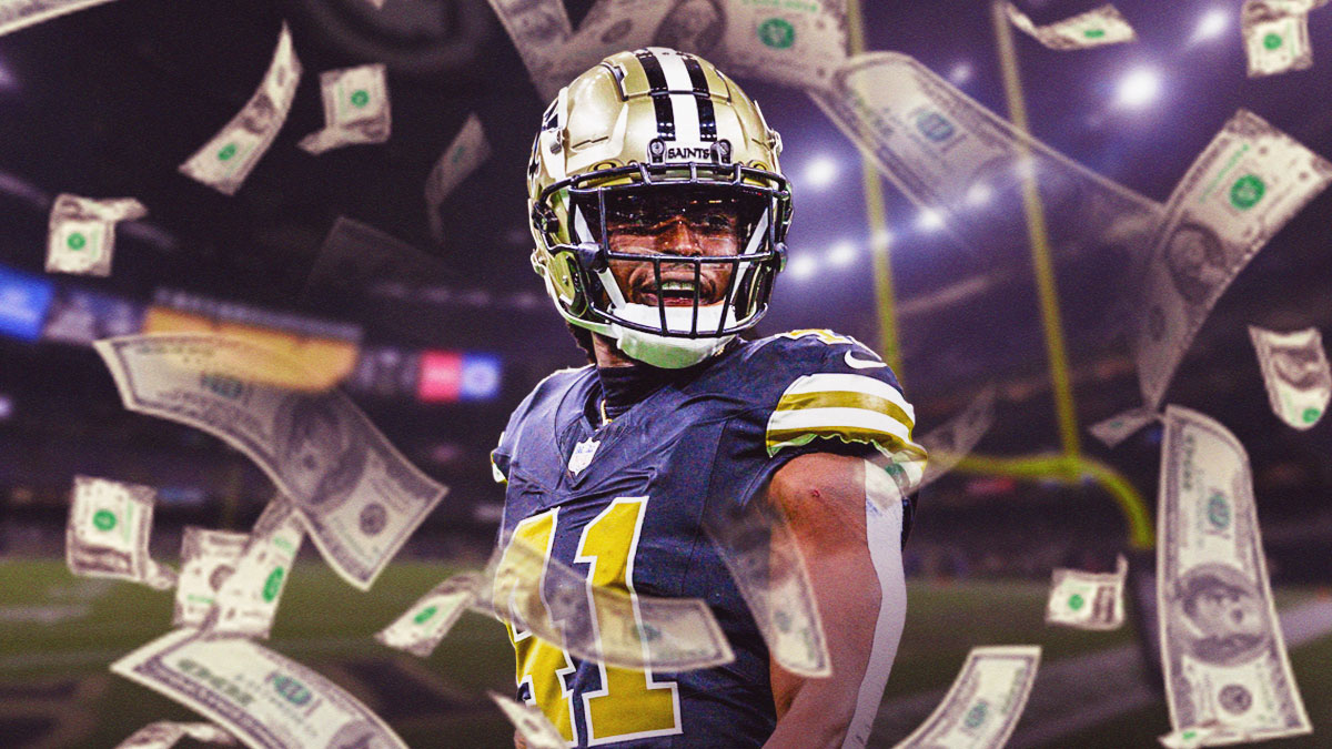 Saints RB Alvin Kamara with money flying around him
