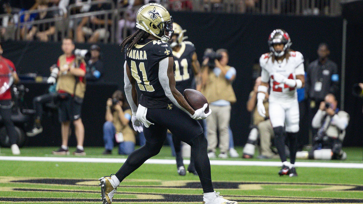 Oct 13, 2024; New Orleans, Louisiana, USA; New Orleans Saints running back Alvin Kamara (41) runs in for a touchdown agains the Tampa Bay Buccaneers during the first half at Caesars Superdome. 