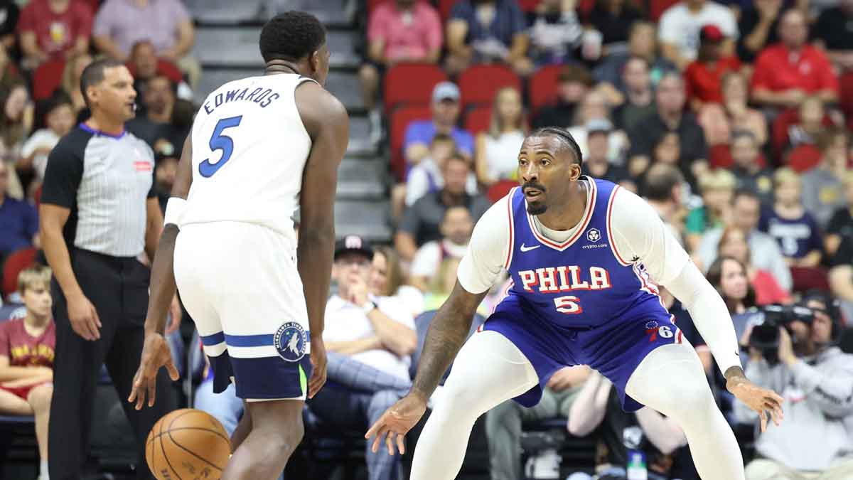 Des Moines, Iowa, USA; Philadelphia 76ers center Andre Drummond (5) defends Minnesota Timberwolves guard Anthony Edwards (5) at Wells Fargo Arena.