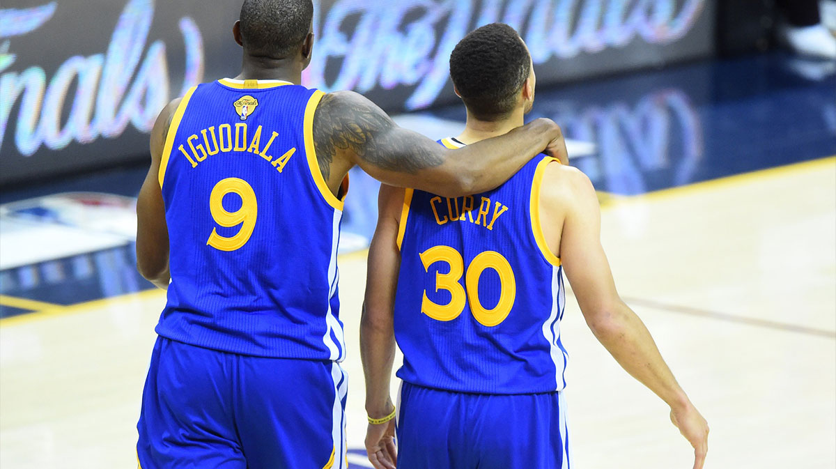 Golden State Warriors forward Andre Iguodala (9) and guard Stephen Curry (30) look on from the court during the fourth quarter in game four of the NBA Finals against the Cleveland Cavaliers at Quicken Loans Arena. The Warriors won 108-97.