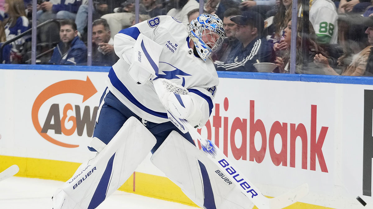 Tampa Bay Lightning goaltender Andrei Vasilevskiy (88) shoots the puck around the boards against the Toronto Maple Leafs during the first period at Scotiabank Arena.