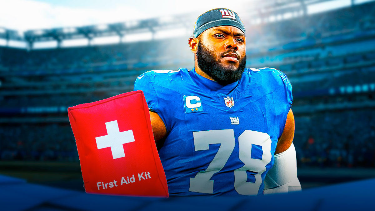 Giants left tackle Andrew Thomas with medical kit next to him