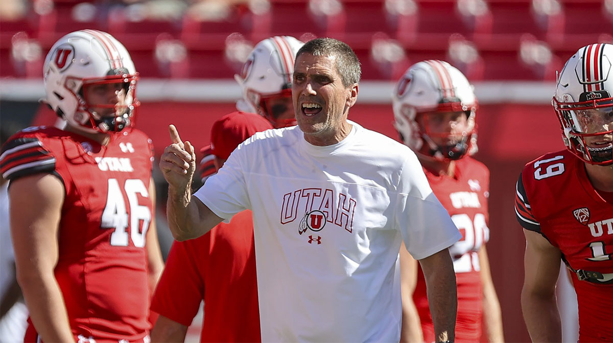 Utah Utes offensive coordinator Andy Ludwig prepares his team before a game against the Weber State Wildcats at Rice-Eccles Stadium.
