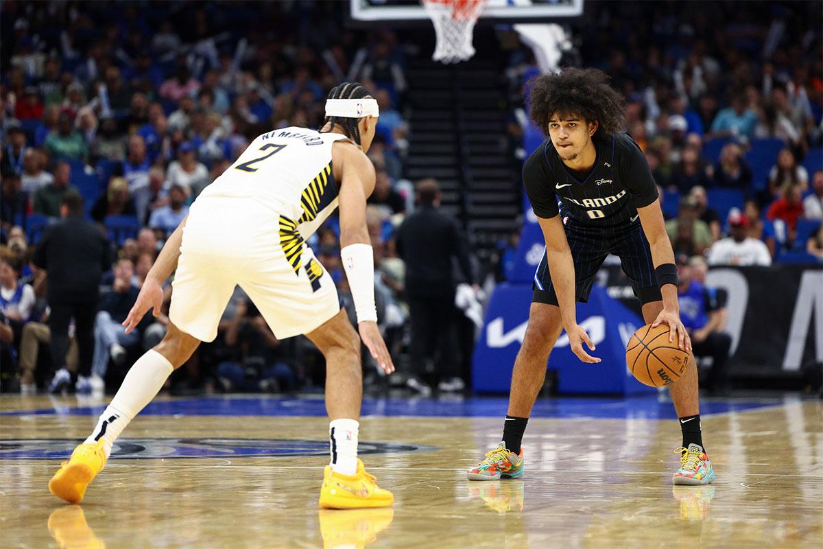 Orlando Magic guard Anthony Black (0) is guarded by Indiana Pacers guard Andrew Nembhard (2) in the first quarter at Kia Center.