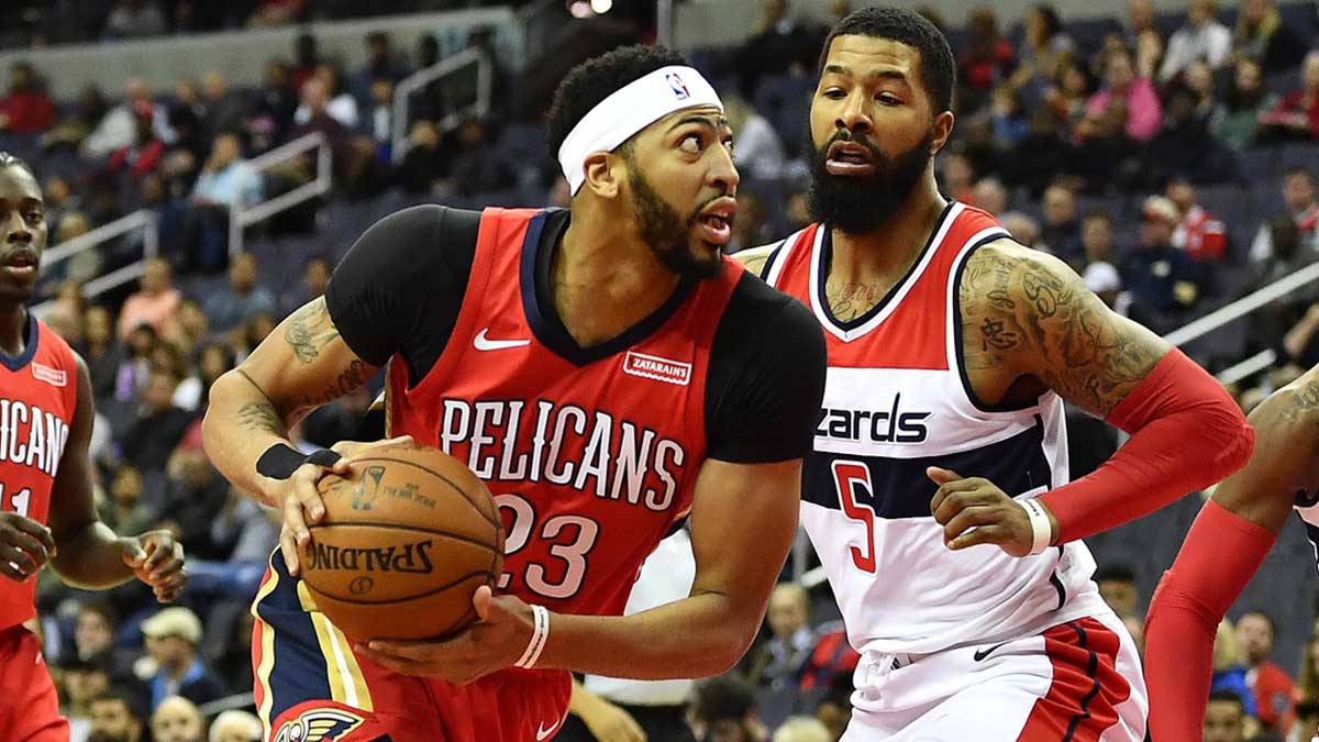 New Orleans Pelicans forward Anthony Davis (23) dribbles past Washington Wizards forward Markieff Morris (5) during the first half at Capital One Arena.