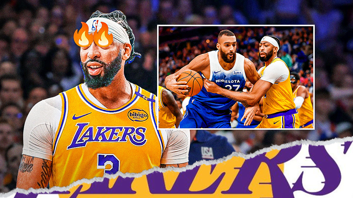 Lakers Anthony Davis with fire in his eyes in front. In background, need Lakers Anthony Davis playing defense against Timberwolves Rudy Gobert.