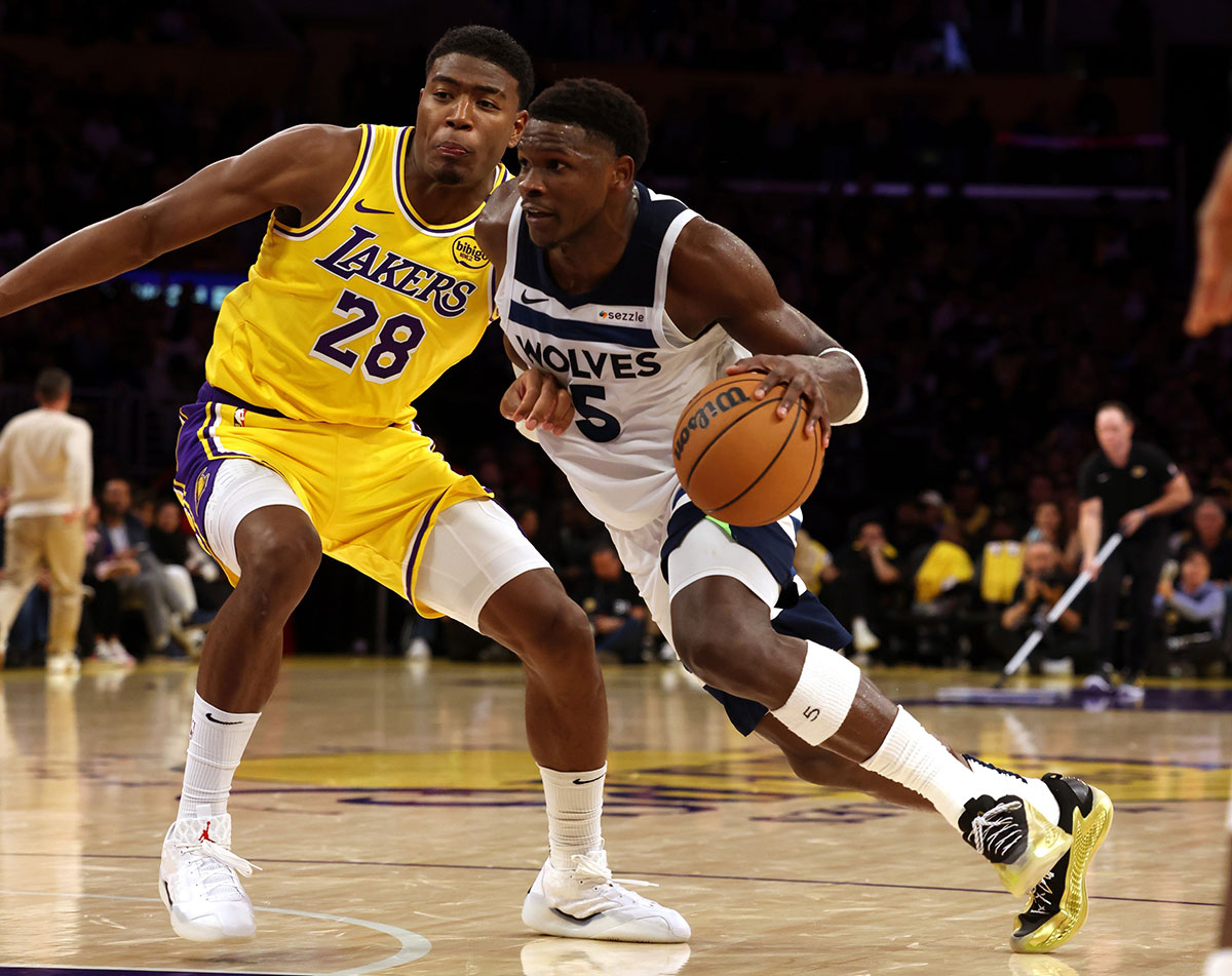 Minnesota Timberwolves guard Anthony Edwards (5) drives against Los Angeles Lakers forward Rui Hachimura (28) during the fourth quarter at Crypto.com Arena.