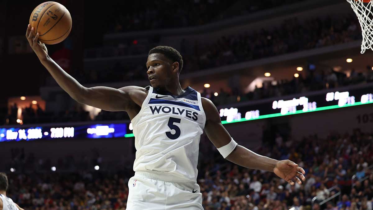 Minnesota Timberwolves guard Anthony Edwards (5) grabs a rebound during their game with the Philadelphia 76ers at Wells Fargo Arena.