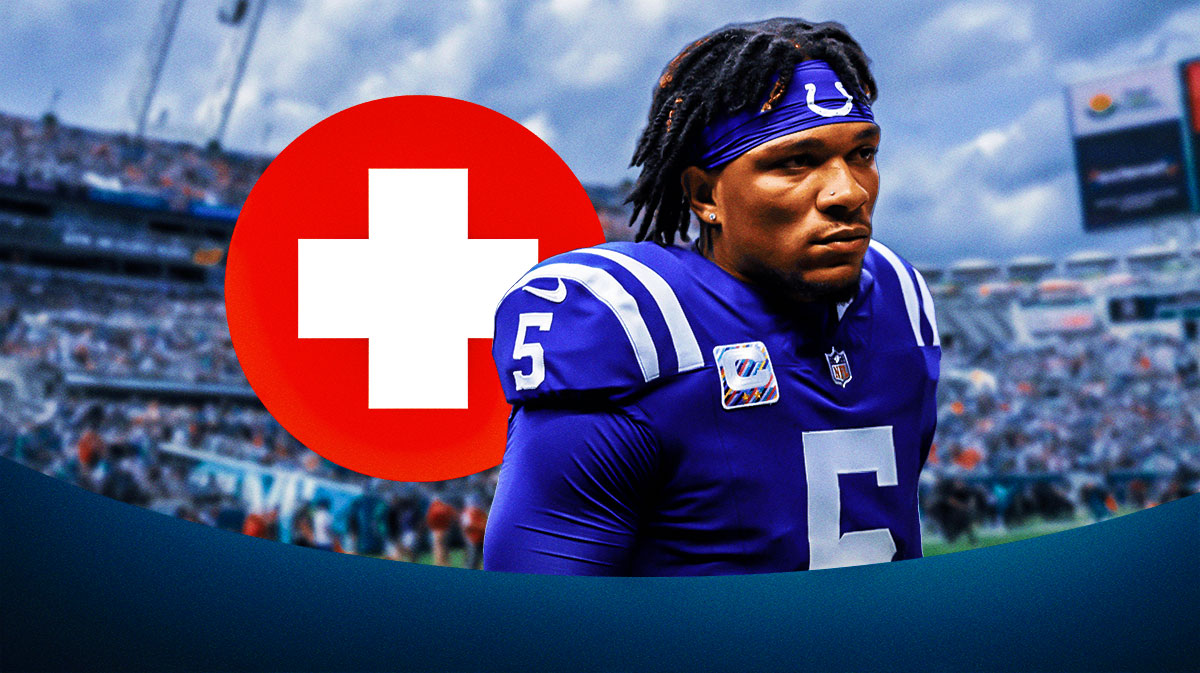 Indianapolis Colts quarterback Anthony Richardson in center, injury sign next to him, Everbank Stadium (home stadium of the Jacksonville Jaguars) in the background