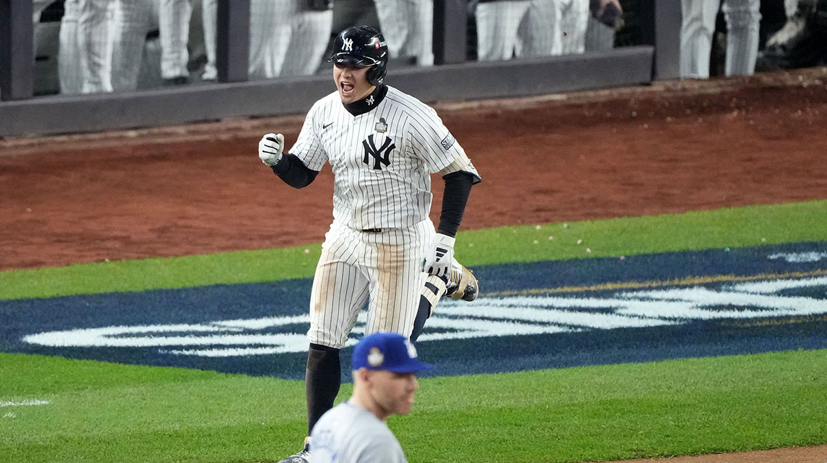 New York Yankees shortstop Anthony Volpe (11) reacts after hitting a grand slam against the Los Angeles Dodgers in the third inning during game four of the 2024 MLB World Series at Yankee Stadium.