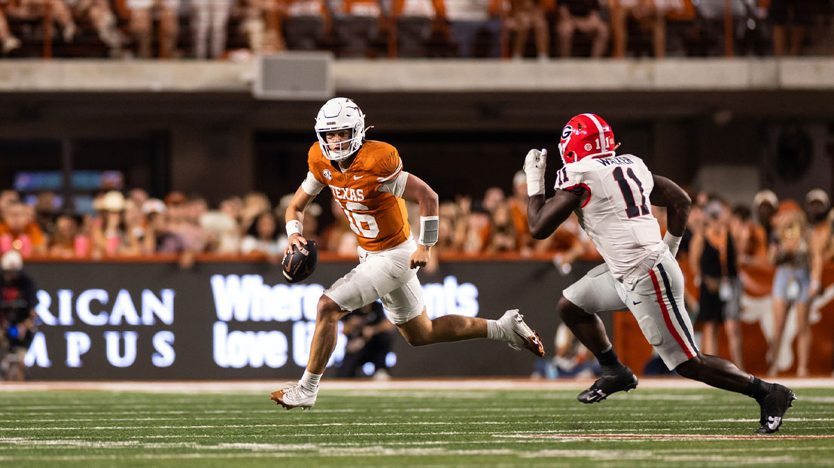 Texas Longhorns quarterback Arch Manning (16) runs the ball against the Georgia Bulldogs during the second quarter at Darrell K Royal-Texas Memorial Stadium.