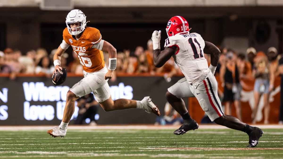 Texas Longhorns quarterback Arch Manning (16) runs the ball against the Georgia Bulldogs during the second quarter at Darrell K Royal-Texas Memorial Stadium.