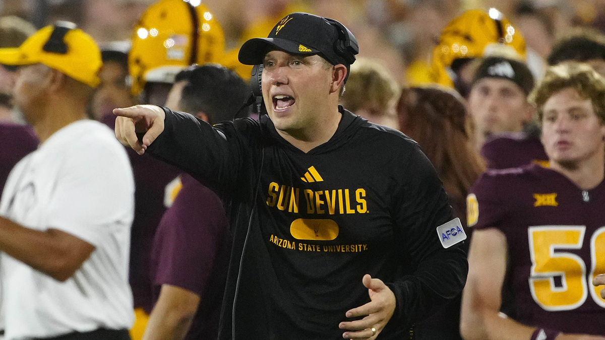 Arizona State head coach Kenny Dillingham calls out to his players against Wyoming during a game at Sun Devil Stadium.