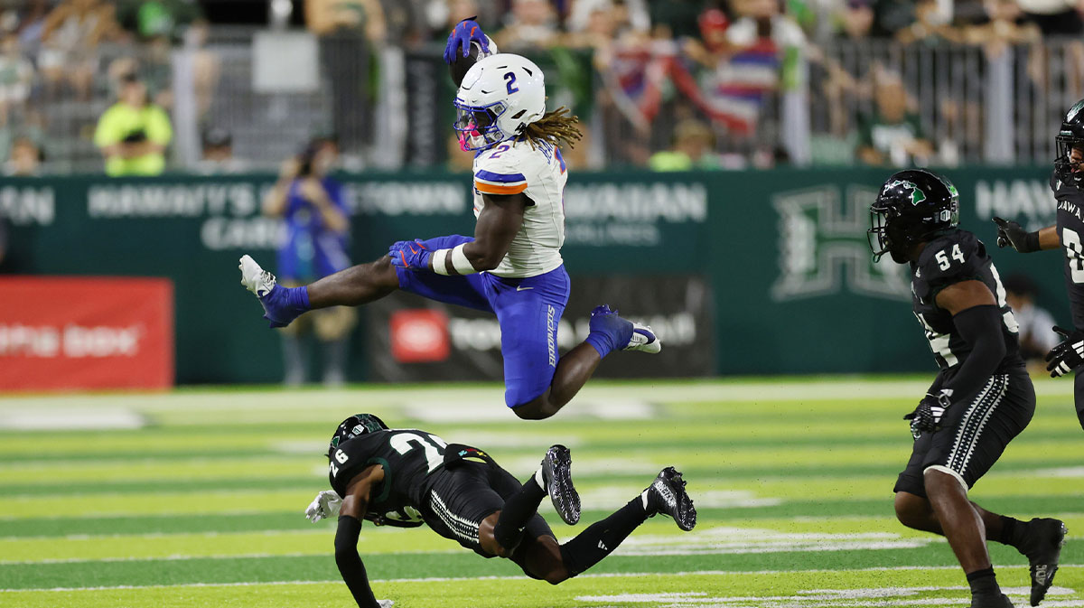 Boise State Broncos running back Ashton Jeanty (2) leaps over Hawaii Rainbow Warriors defensive back Deliyon Freeman (26) during the second quarter at Clarence T.C. Ching Athletics Complex. The play was called back due to a Broncos foul.