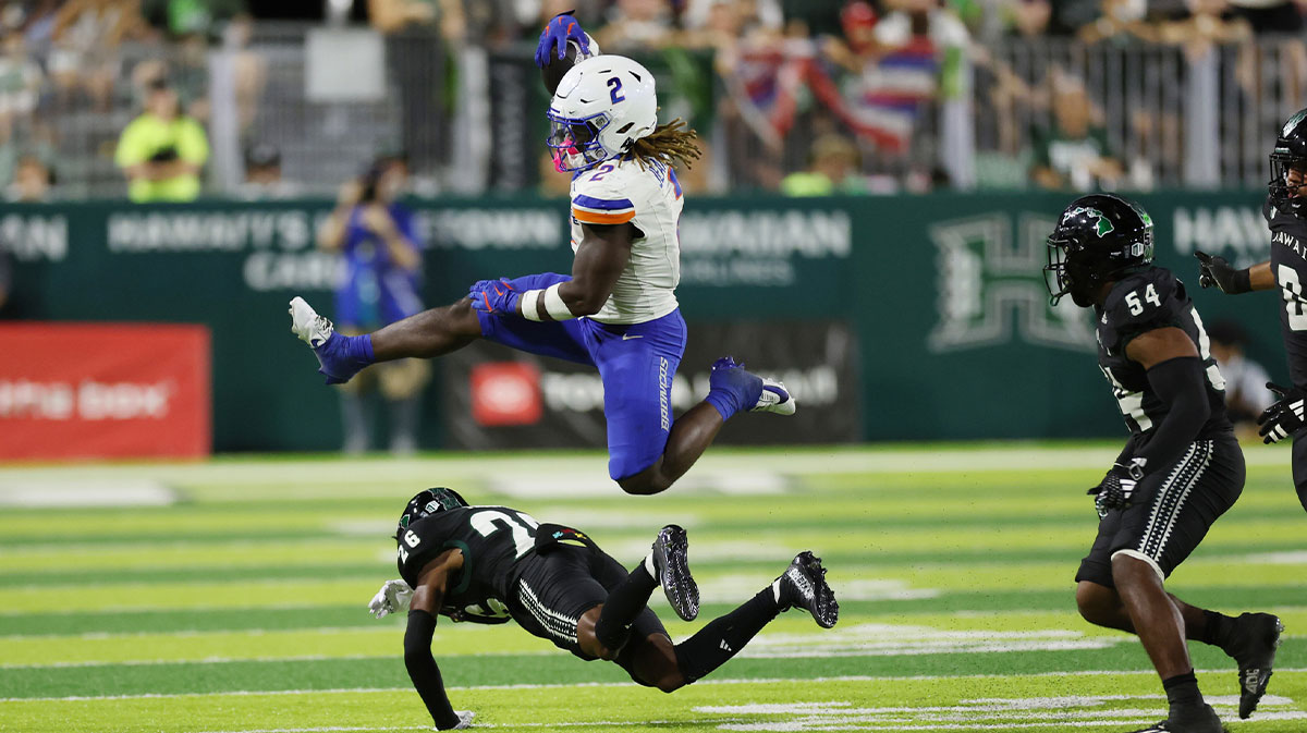 Boise State Broncos running back Ashton Jeanty (2) leaps over Hawaii Rainbow Warriors defensive back Deliyon Freeman (26) during the second quarter at Clarence T.C. Ching Athletics Complex. The play was called back due to a Broncos foul.