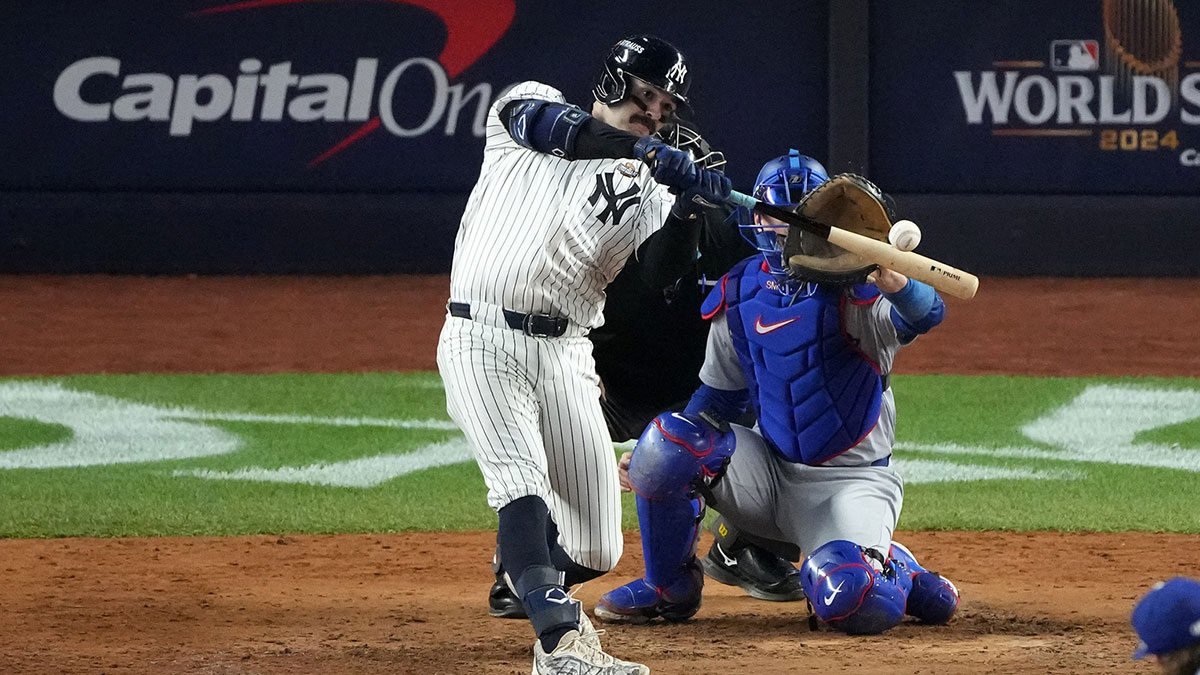 Oct 29, 2024; Bronx, New York, USA; New York Yankees catcher Austin Wells (28) hits a home run against the Los Angeles Dodgers in the sixth inning during game four of the 2024 MLB World Series at Yankee Stadium.