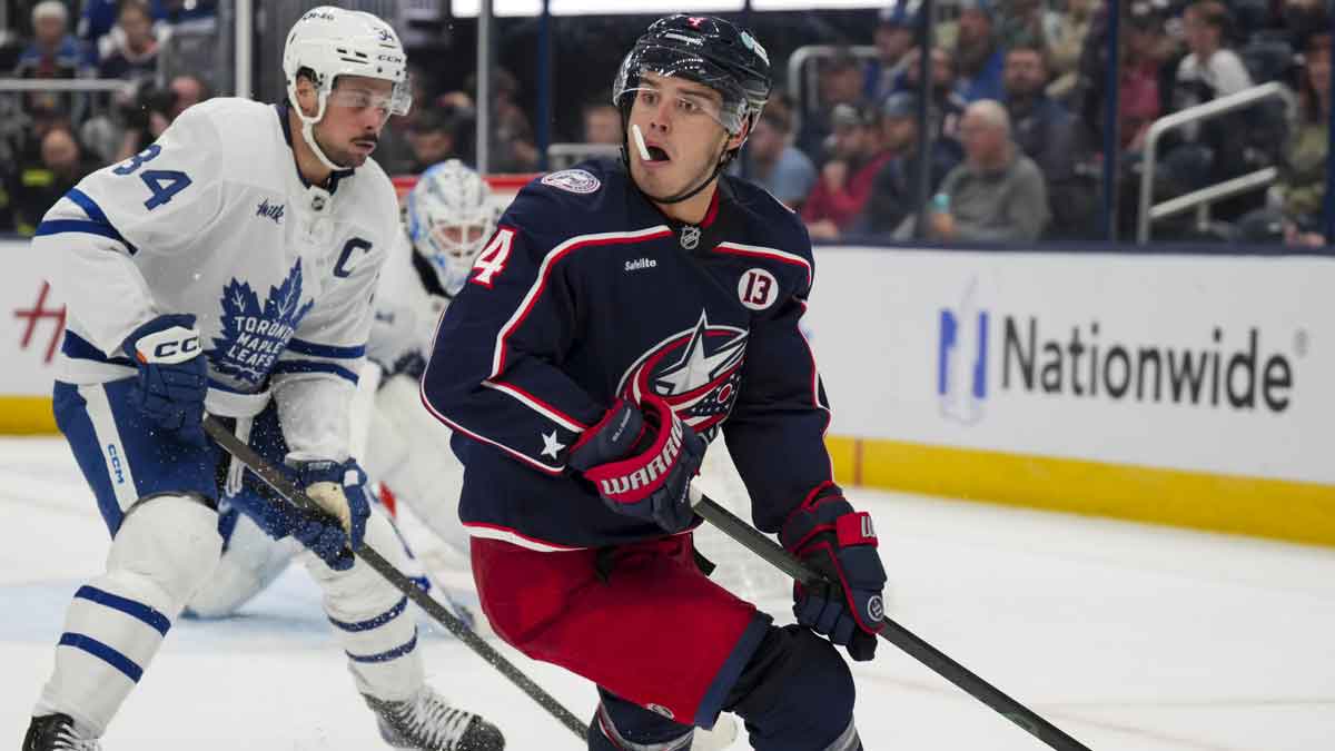 Columbus Blue Jackets center Cole Sillinger (4) reacts as he skates with the puck against Toronto Maple Leafs center Auston Matthews (34) during the second period at Nationwide Arena