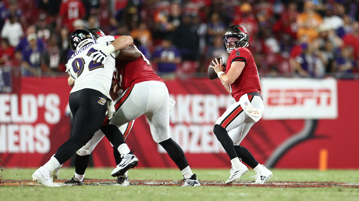 Tampa Bay Buccaneers quarterback Baker Mayfield (6) drops back to pass against the Baltimore Ravens in the fourth quarter at Raymond James Stadium.