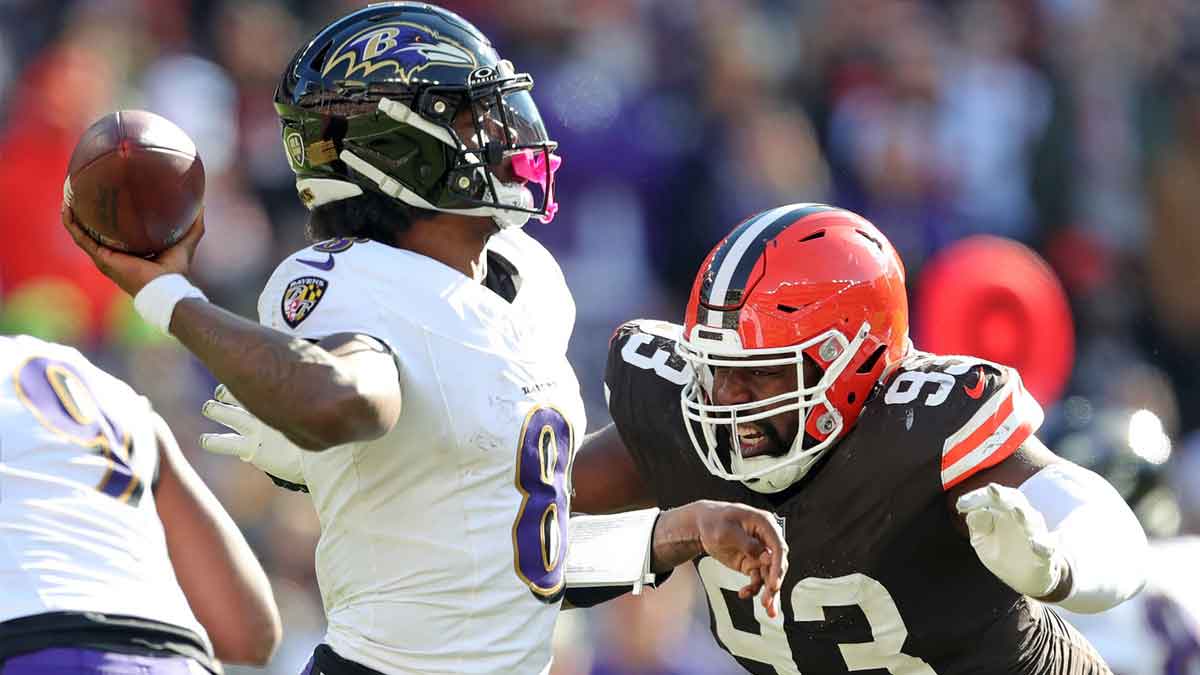 Cleveland Browns defensive tackle Shelby Harris (93) closes in on Baltimore Ravens quarterback Lamar Jackson (8) during the second half of an NFL football game at Huntington Bank Field, Sunday, Oct. 27, 2024, in Cleveland, Ohio.