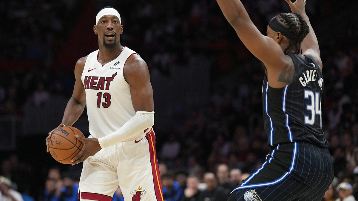 Miami Heat center Bam Adebayo (13) looks to pass the ball as Orlando Magic center Wendell Carter Jr. (34) defends during the first half at Kaseya Center.