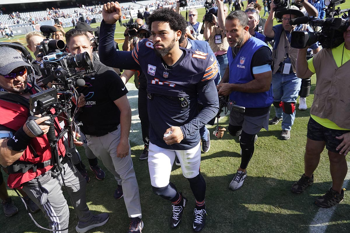  Bears quarterback Caleb Williams (18) gestures to the crowd after the game against the Carolina Panthers at Soldier Field