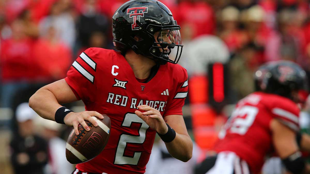 Texas Tech Red Raiders quarterback Behren Morton (2) scrambles in the first half during the game against the Baylor Bears at Jones AT&T Stadium and Cody Campbell Field.