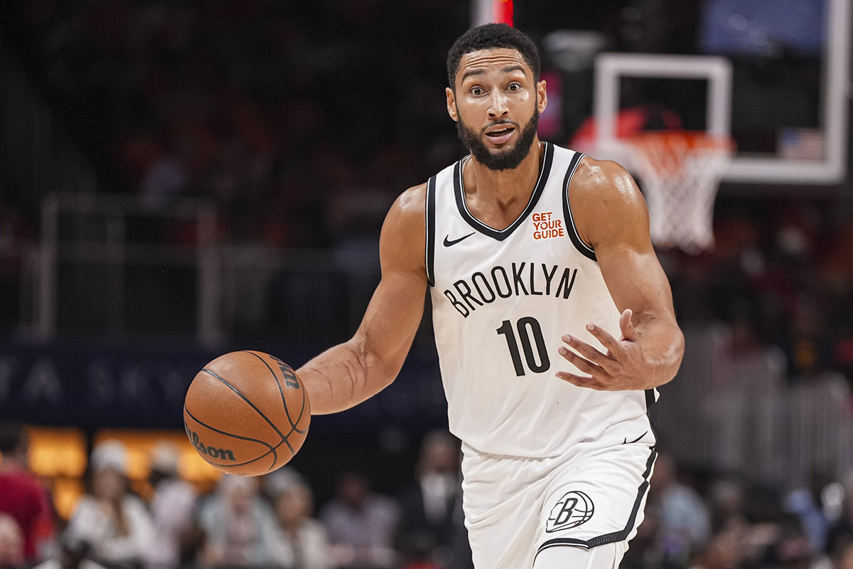 Brooklyn Nets guard Ben Simmons (10) directs teammates while controlling the ball during the first half at State Farm Arena.