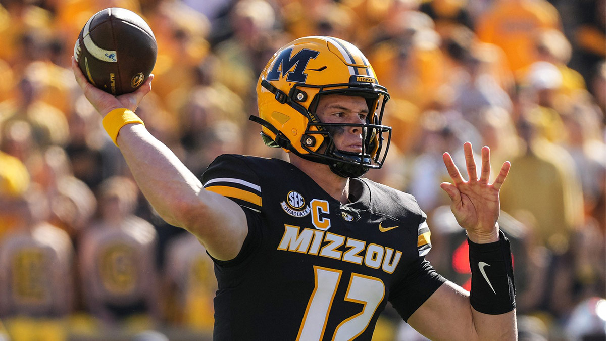 Missouri Tigers quarterback Brady Cook (12) throws a pass during the first half against the Auburn Tigers at Faurot Field at Memorial Stadium.